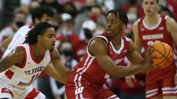 Wisconsin guard Jahcobi Neath with the basketball for in the post.